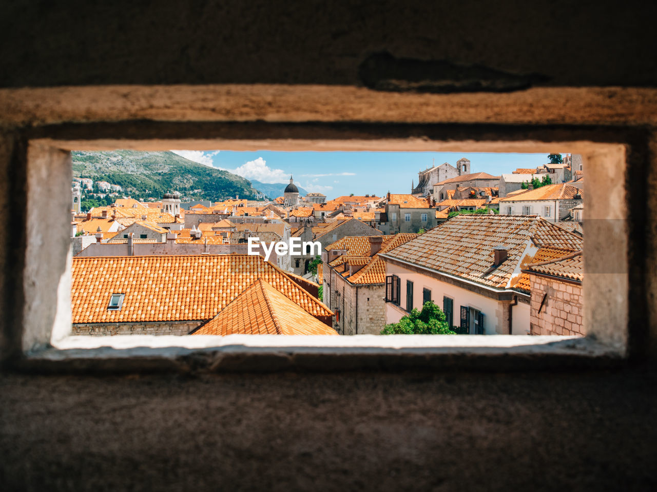 Residential buildings in town as seen through window