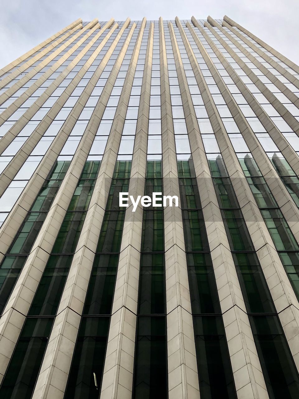 Low angle view of modern building against sky in city