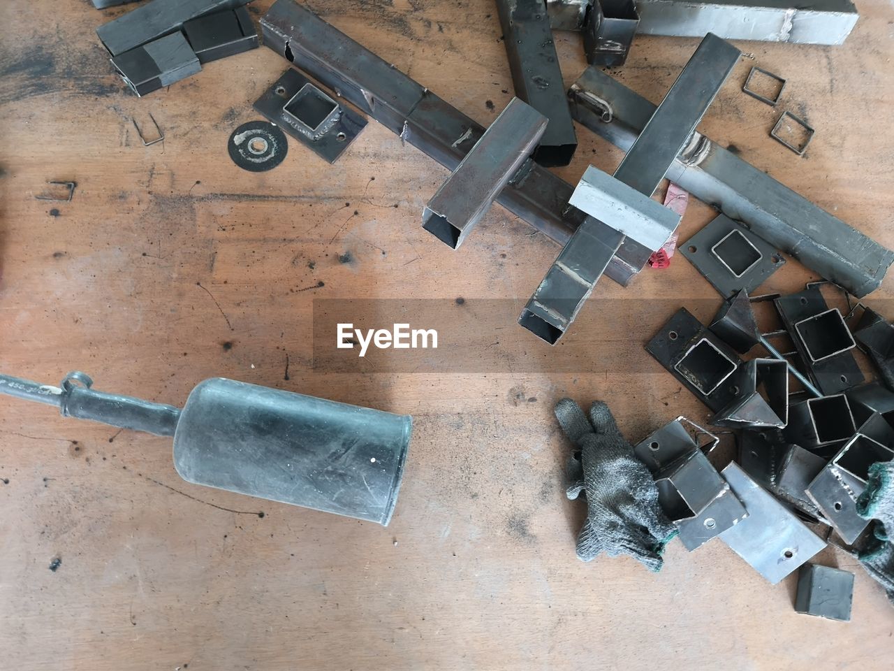 High angle view of metallic parts on table