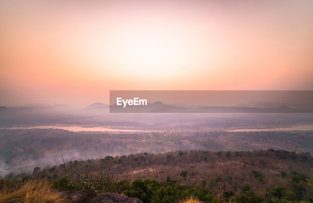 Scenic view of landscape against sky during sunset