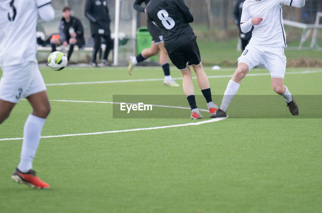 rear view of people playing soccer