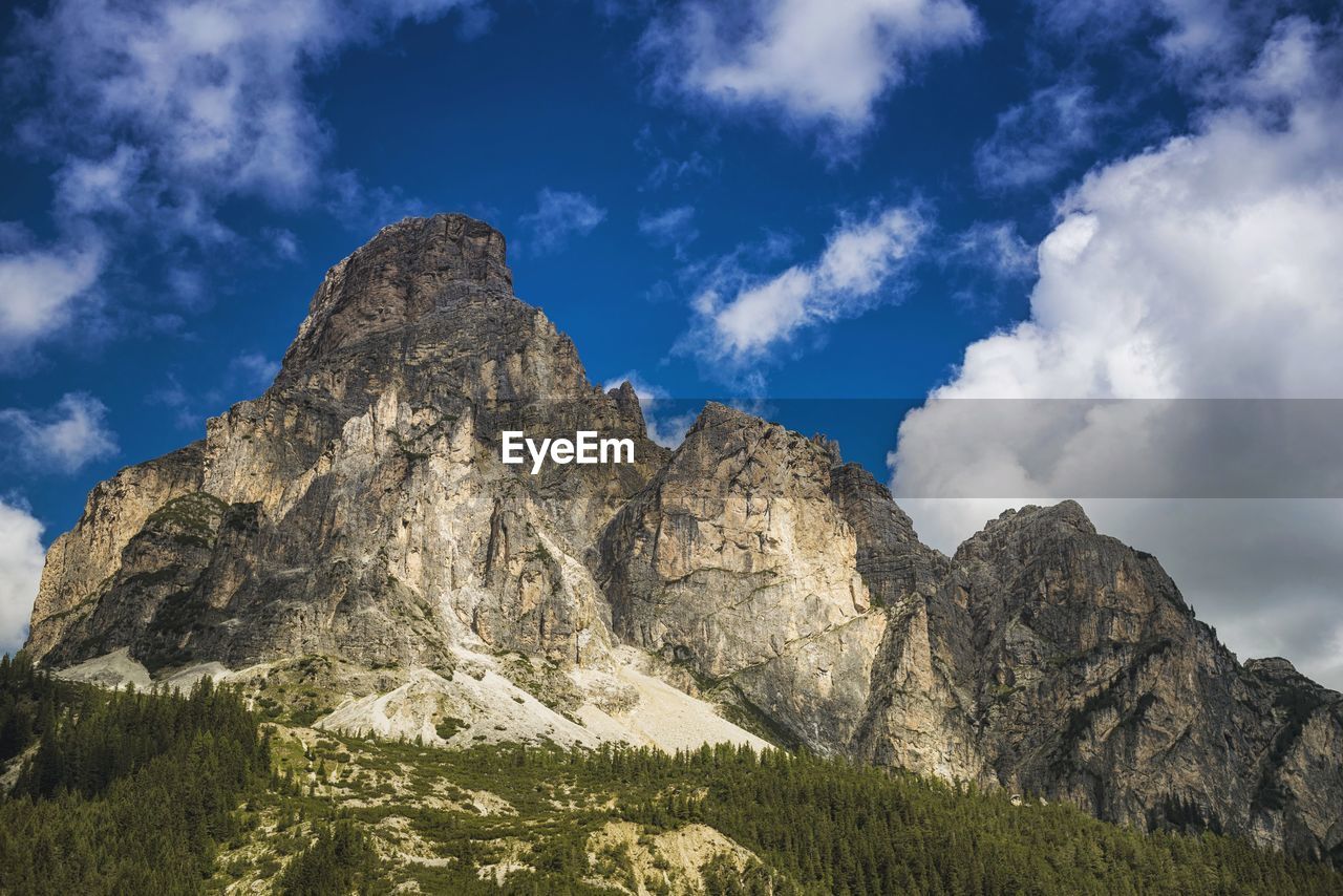 Low angle view of rocky mountains at corvara