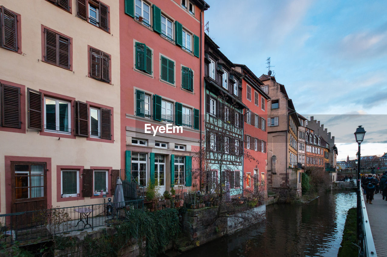 Residential buildings and houses in the old town of strasbourg, france with canal of river ill