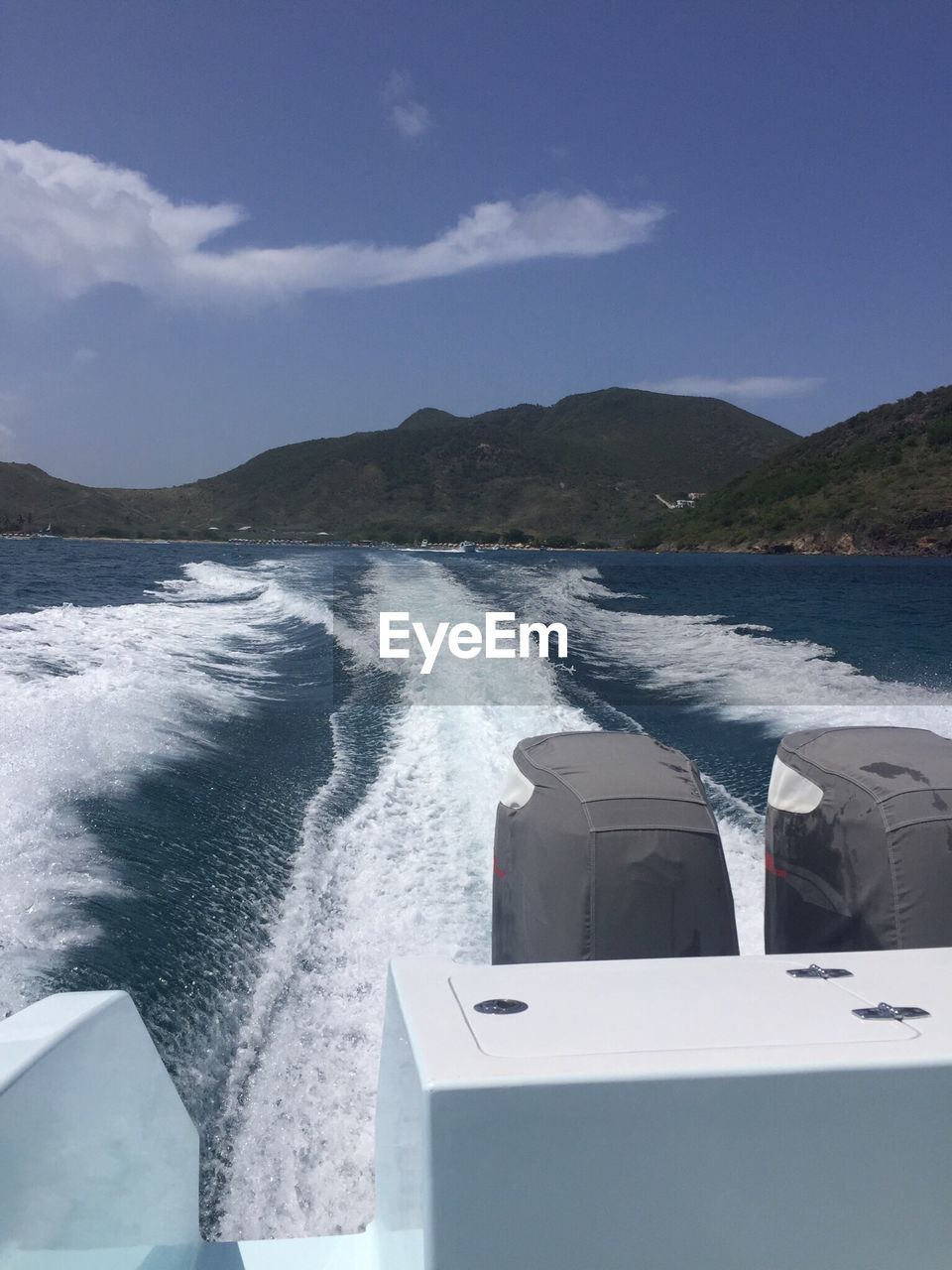 SCENIC VIEW OF SEA WITH MOUNTAIN IN BACKGROUND