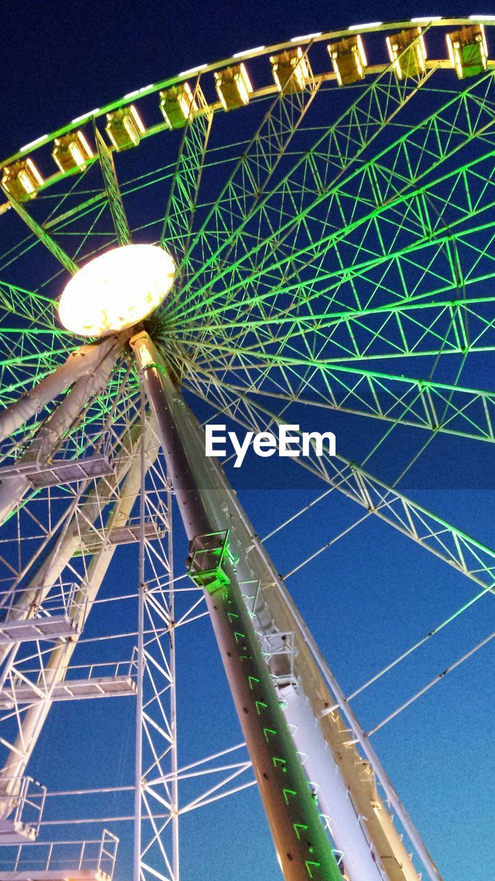 LOW ANGLE VIEW OF FERRIS WHEEL AGAINST SKY