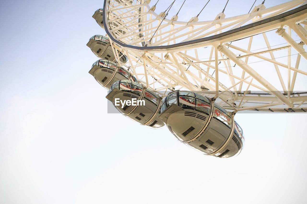 LOW ANGLE VIEW OF ROLLERCOASTER AGAINST SKY