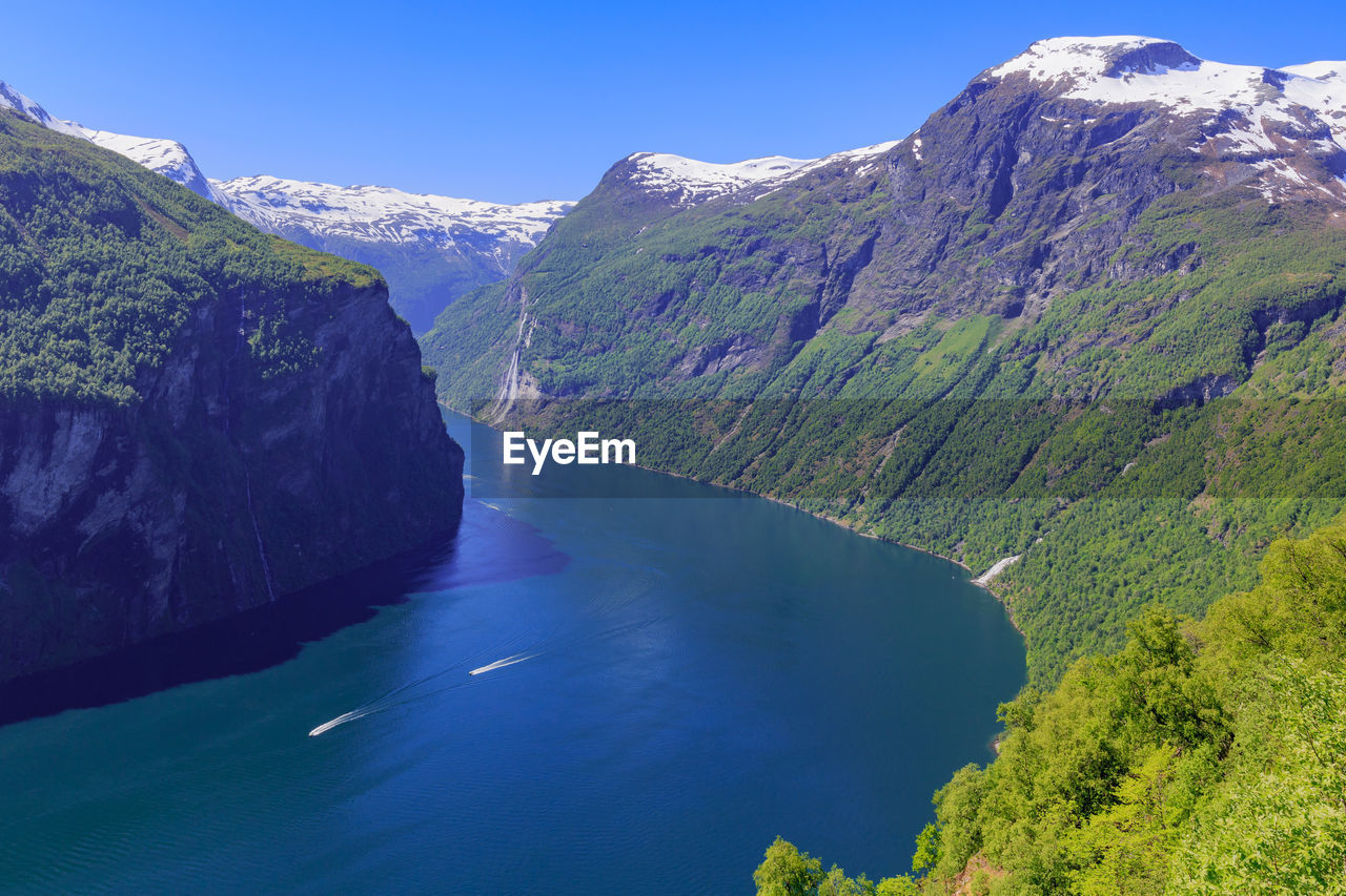 Scenic view of waterfall against sky