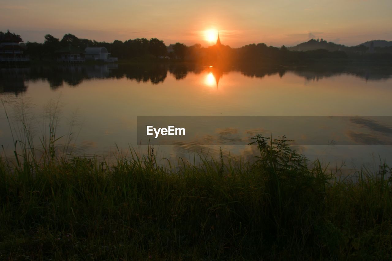 SCENIC VIEW OF LAKE DURING SUNSET