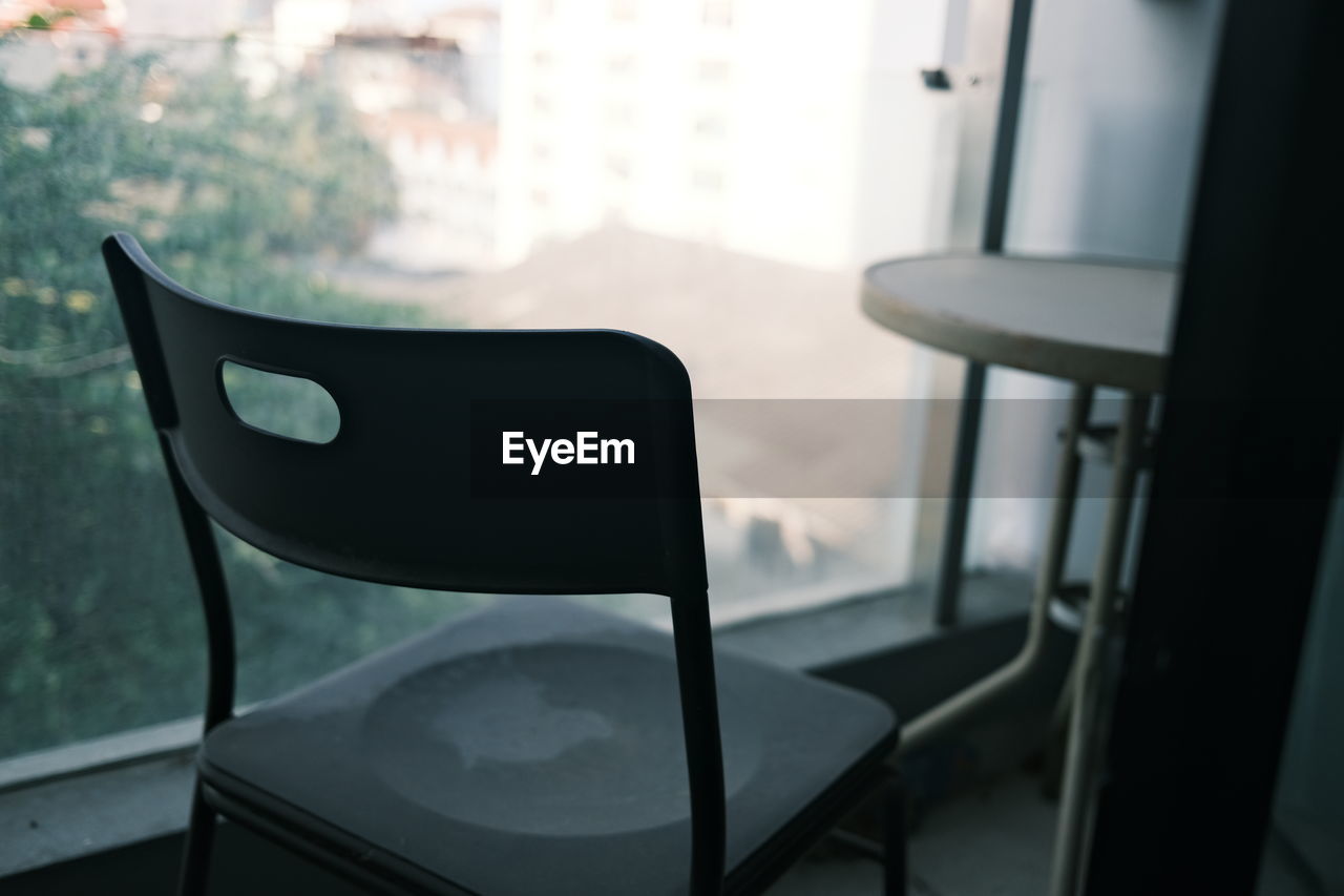 Close-up of empty chair on table