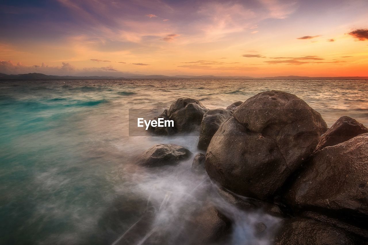 Scenic view of sea against sky during sunset