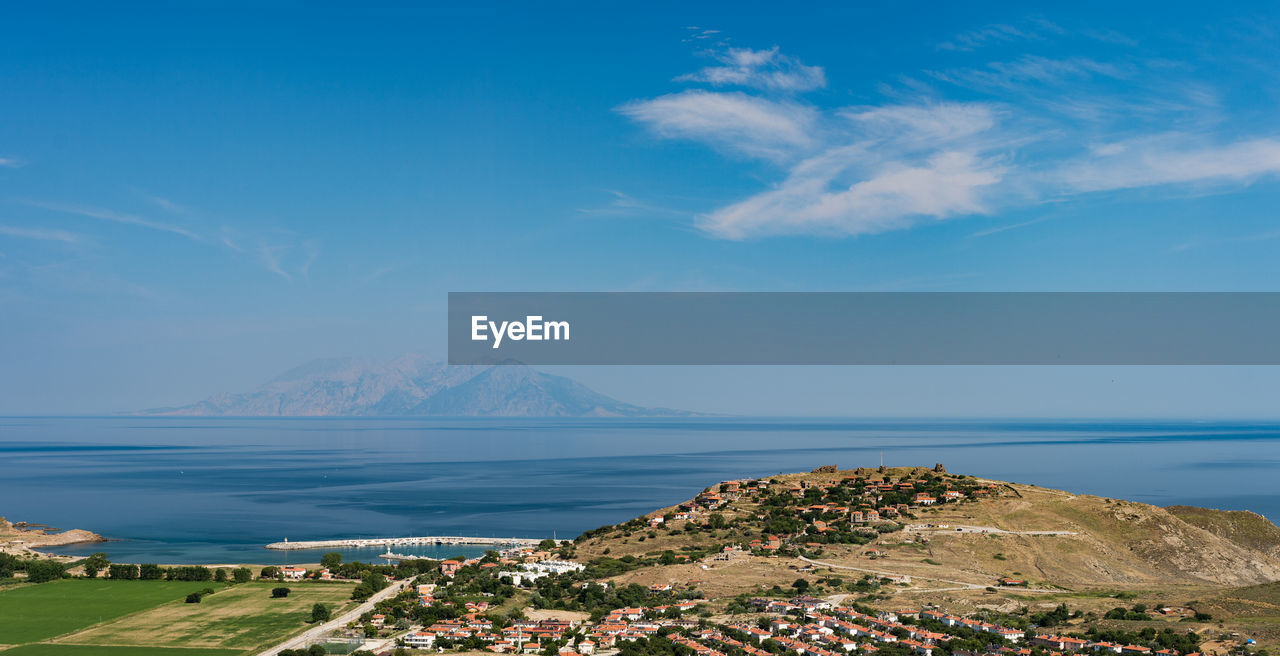 Scenic view of imbros island by sea against sky