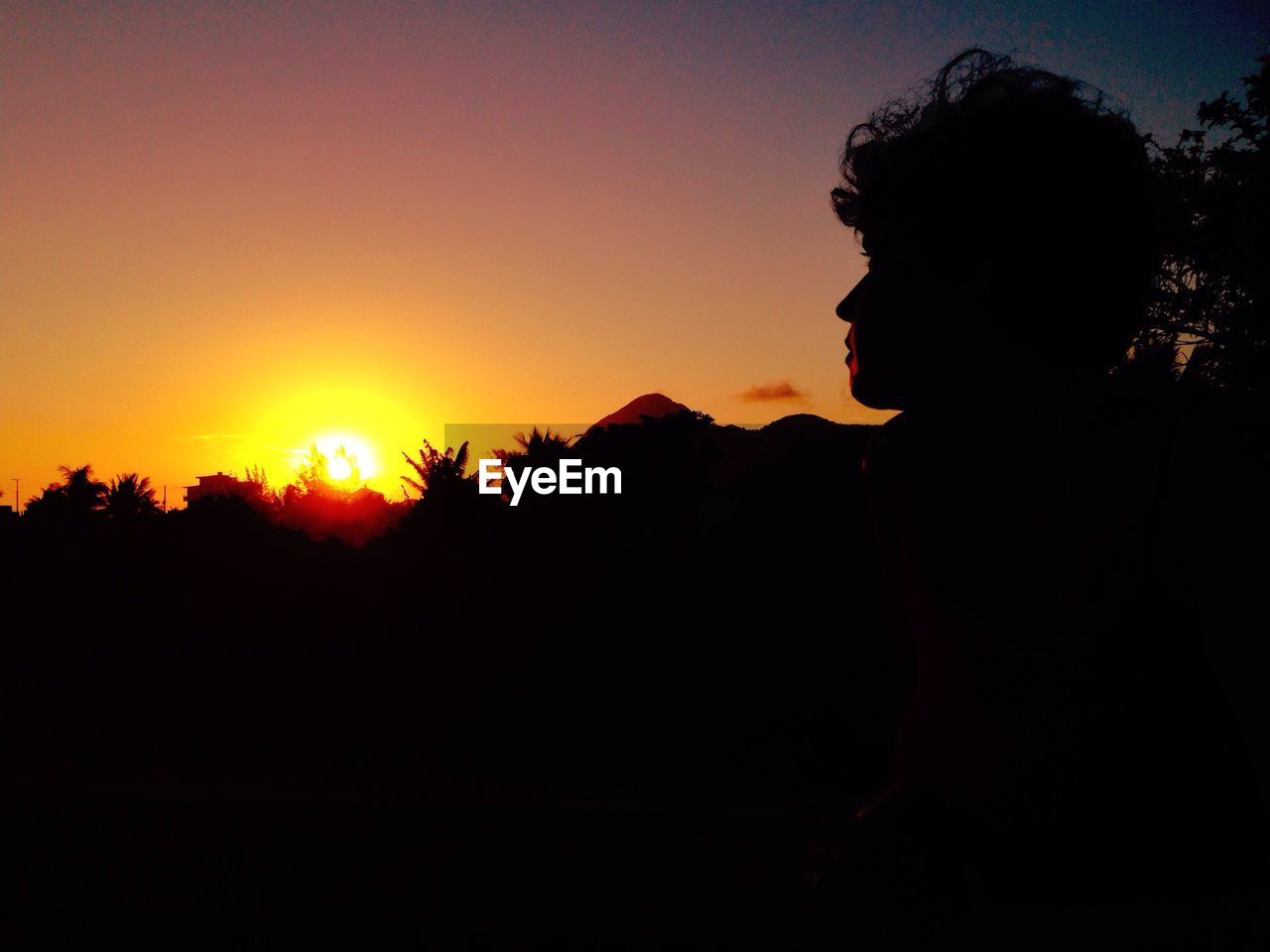 Person looking at sunset