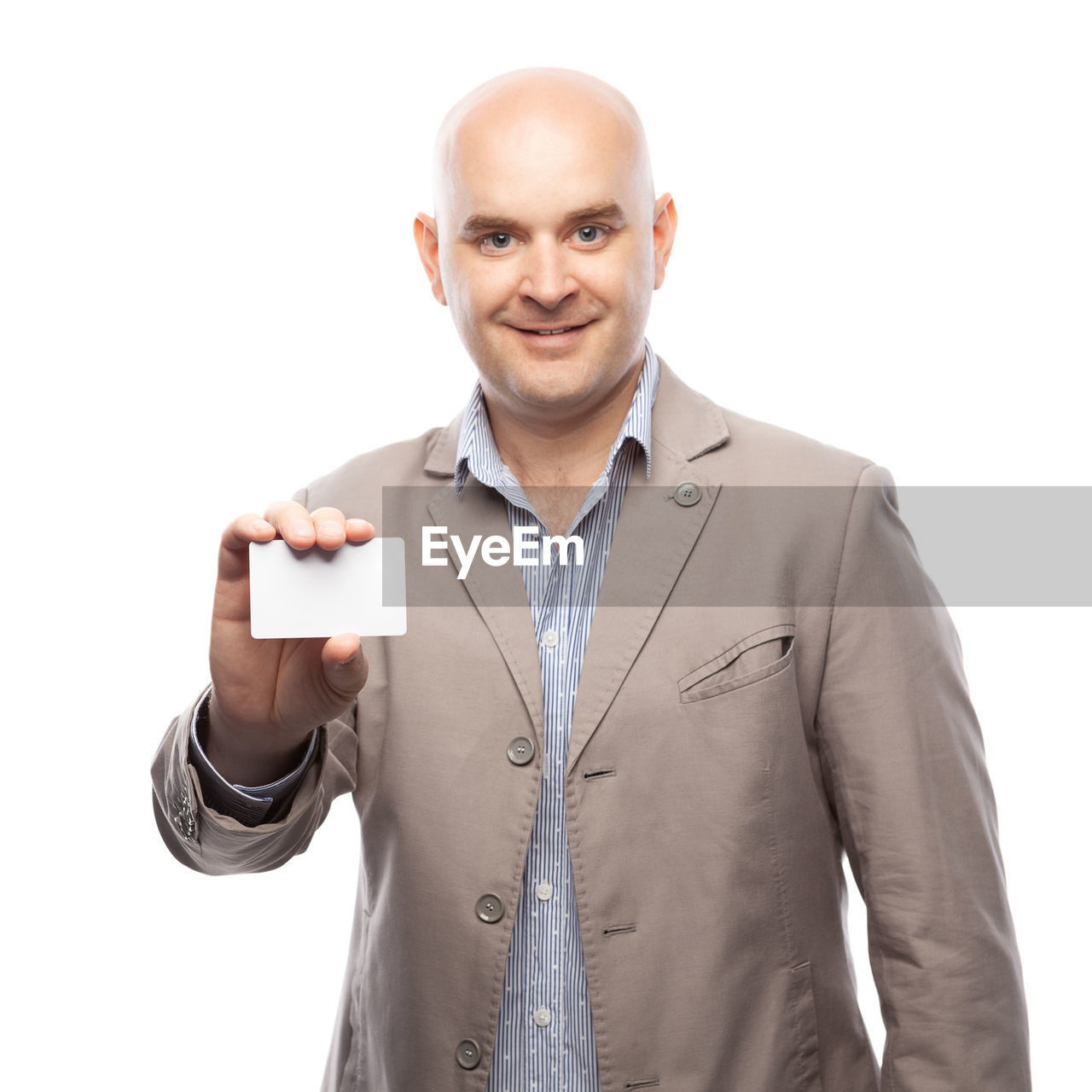 PORTRAIT OF SMILING MAN STANDING ON WHITE BACKGROUND