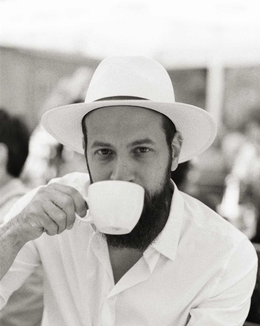 Close-up portrait of man holding drinking glass