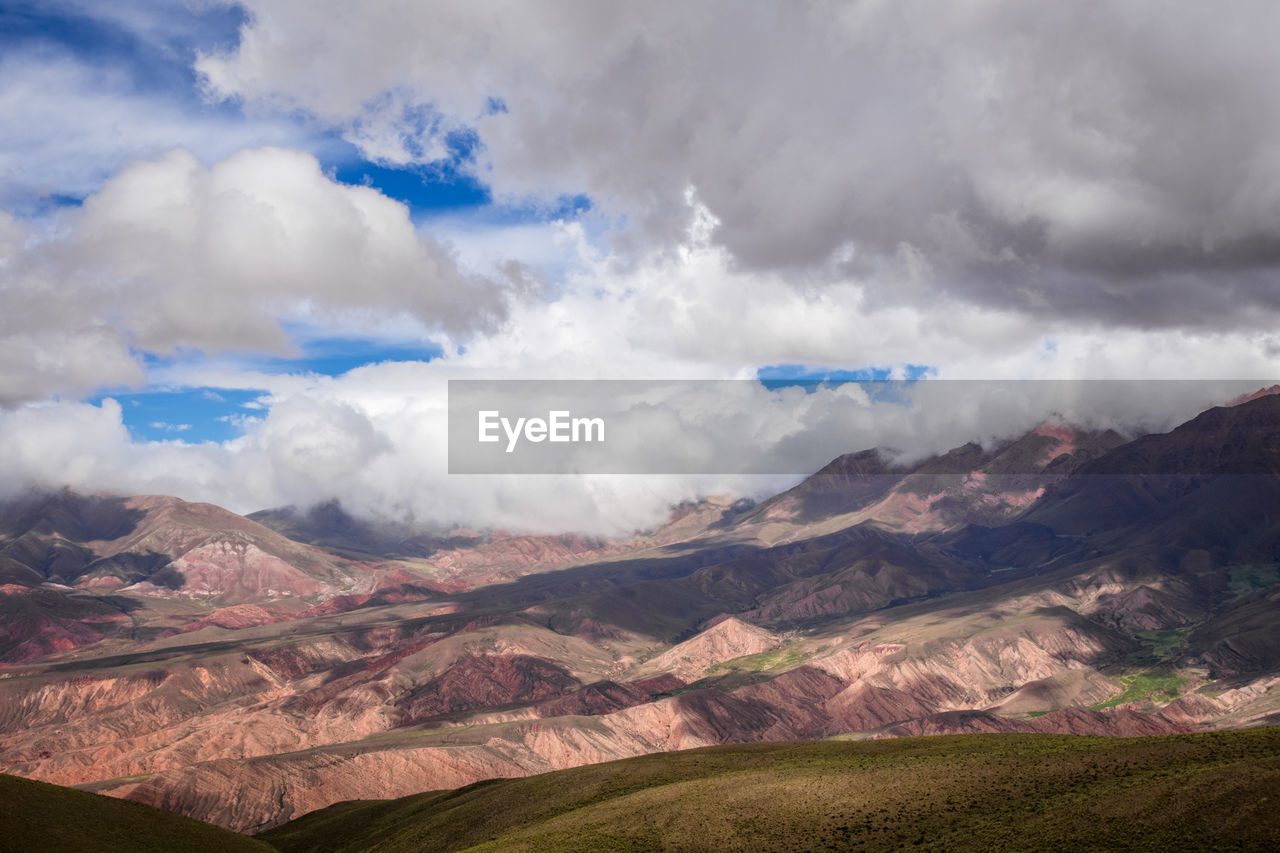 SCENIC VIEW OF CLOUDS OVER MOUNTAIN