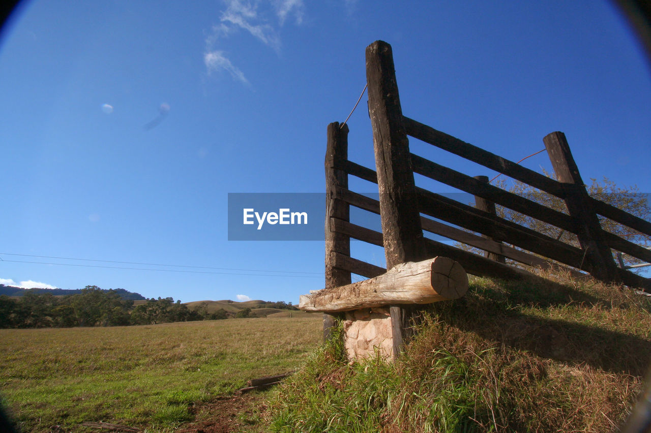 BUILT STRUCTURE ON FIELD AGAINST SKY