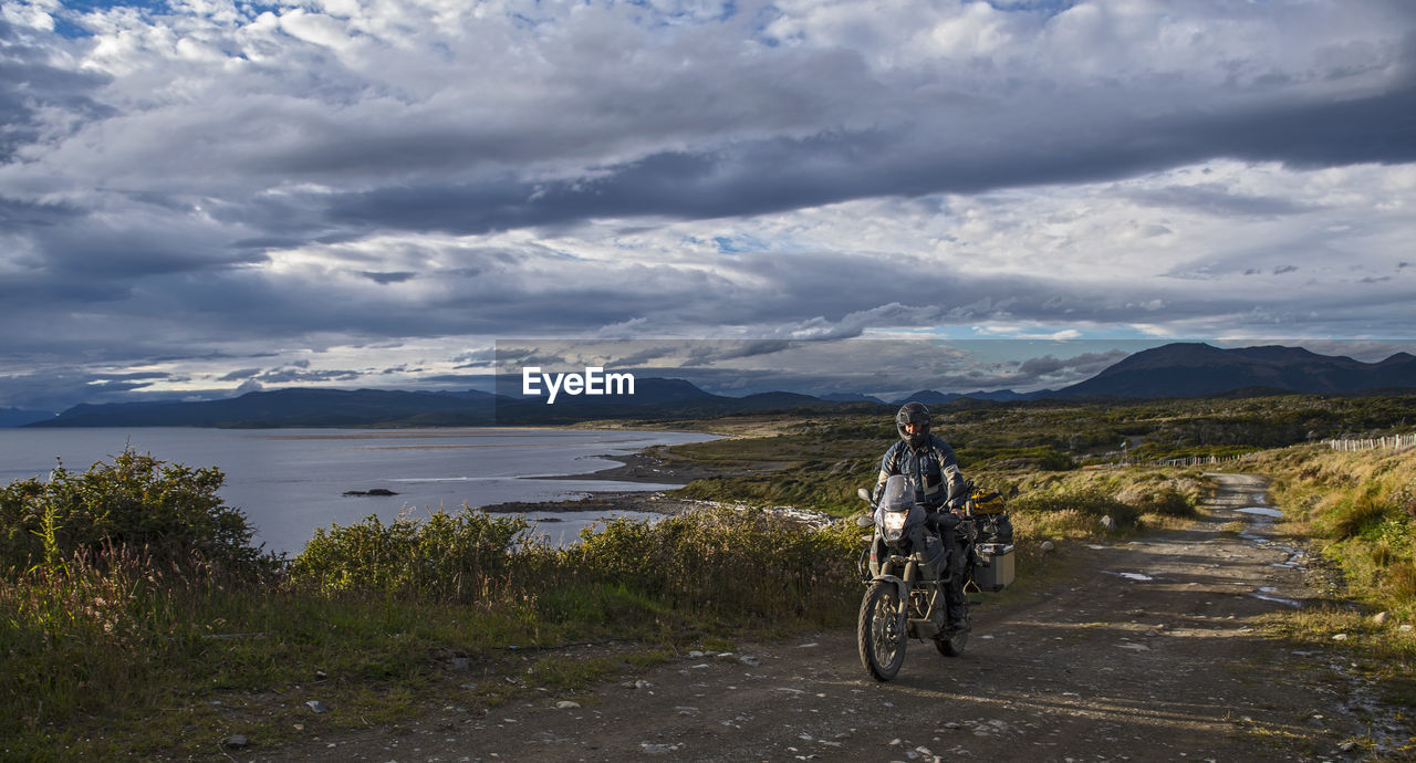Man on off road touring motorbike riding in tierra del fuego