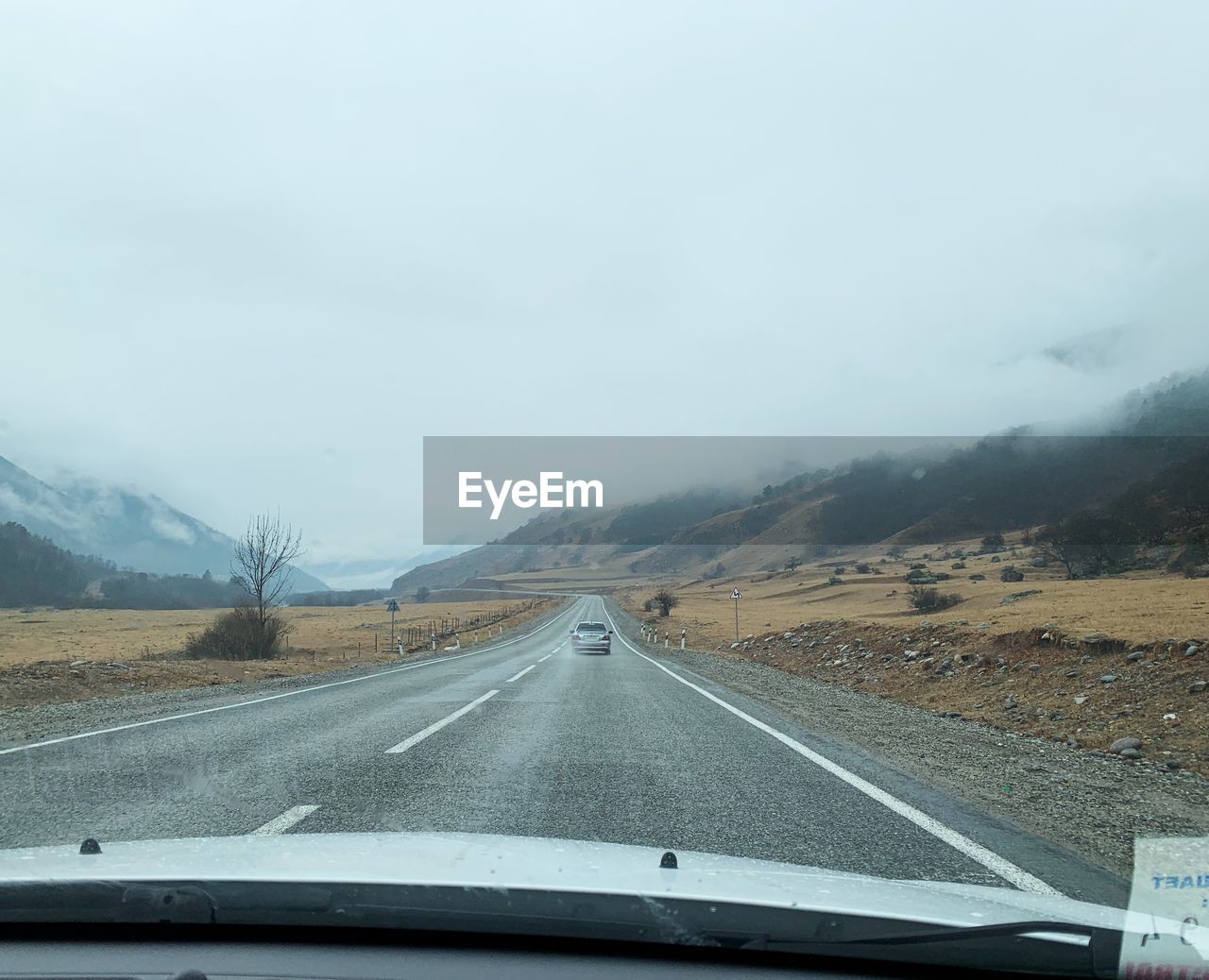 Road seen through car windshield