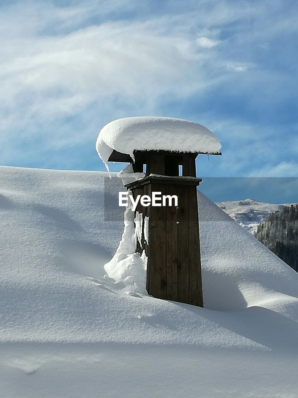 Low angle view of snow covered landscape against sky