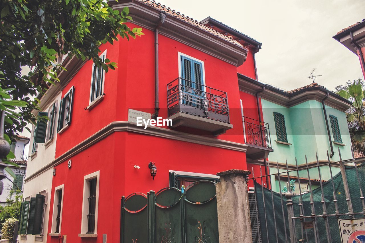 LOW ANGLE VIEW OF RED BUILDING