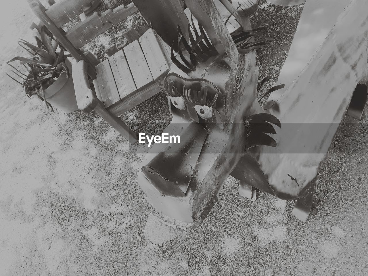 HIGH ANGLE VIEW OF ABANDONED MACHINERY ON SNOW