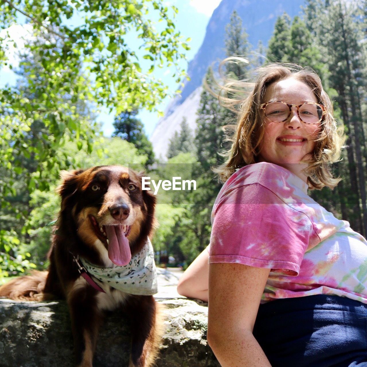 PORTRAIT OF SMILING WOMAN WITH DOG