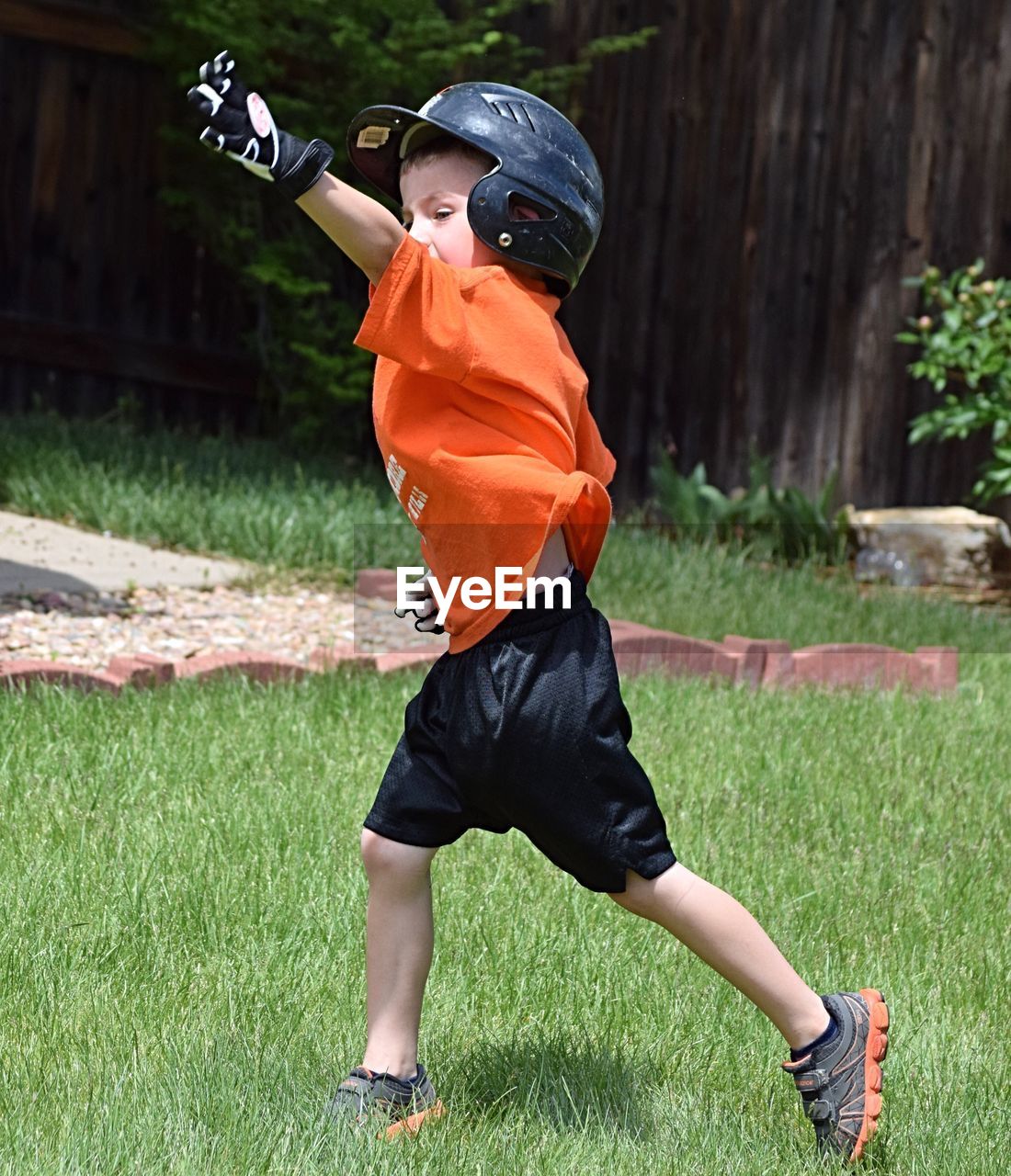 Rear view of boy on field