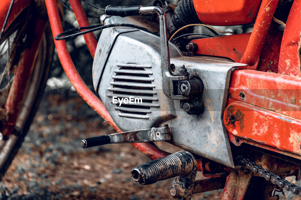 Close-up photo of vintage red motorcycle