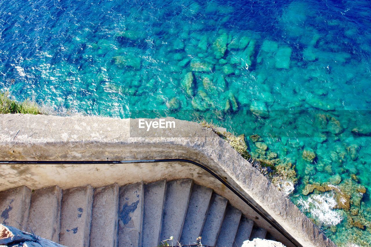 High angle view of sea and steps