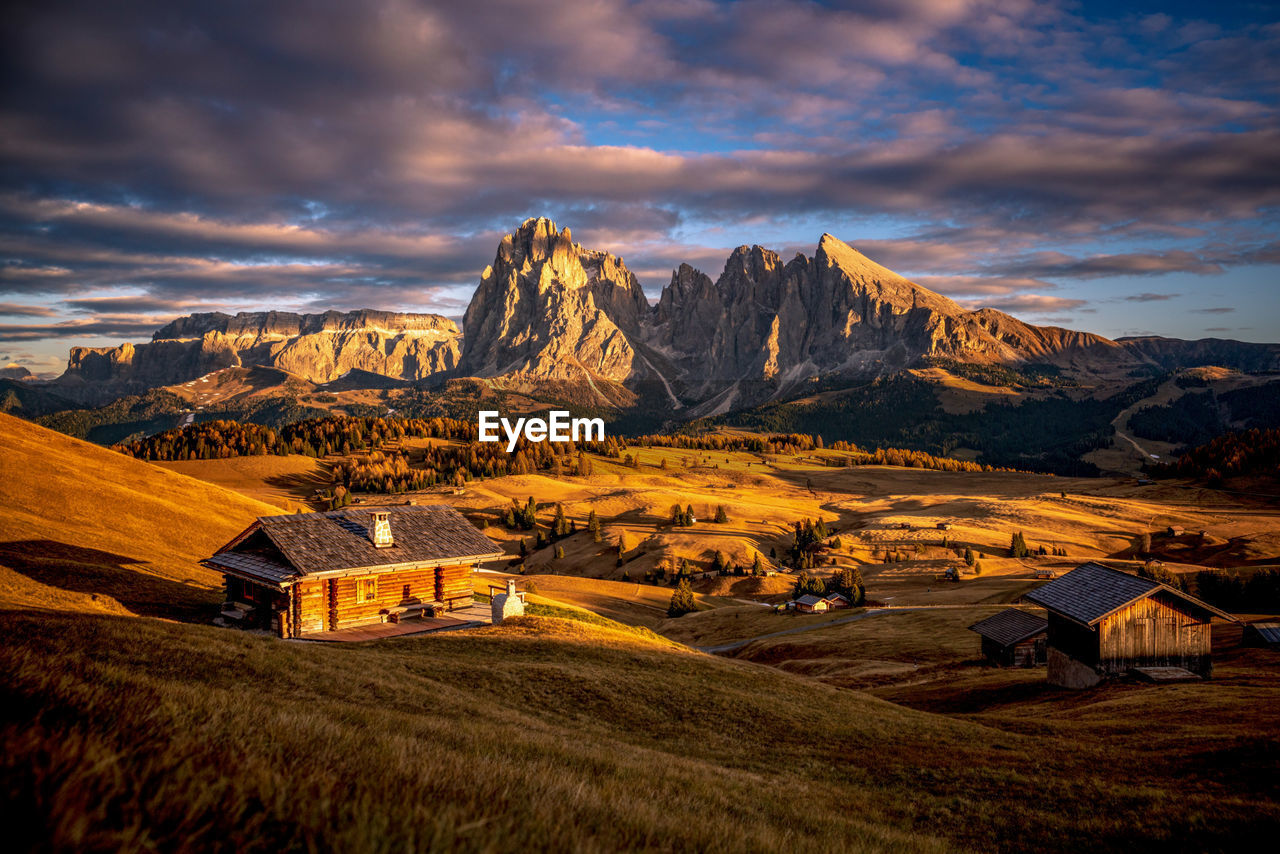 Sassolungo mountain group above alpe di siusi in val gardena, south tyrol, italy in autumn.