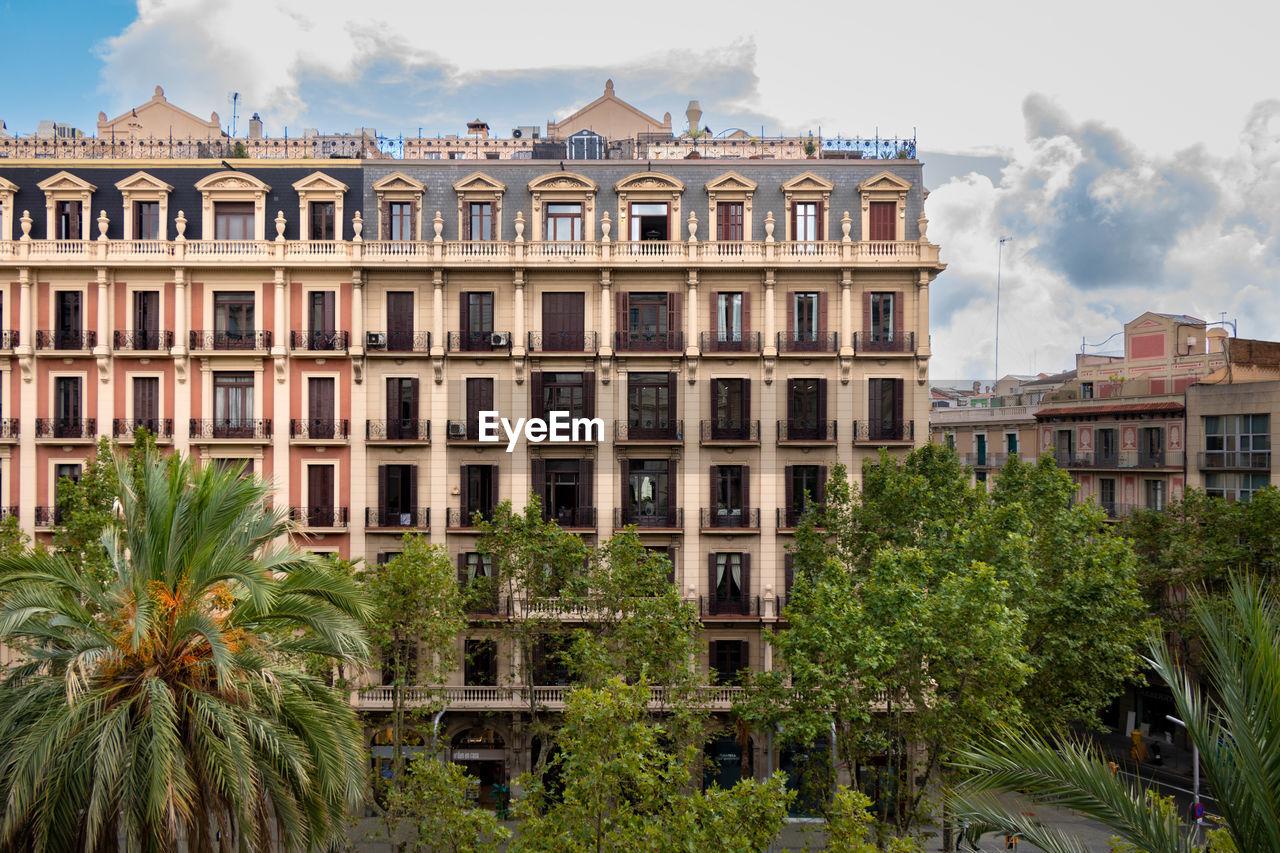 Front side of a beautiful building in barcelona city on a sunny day