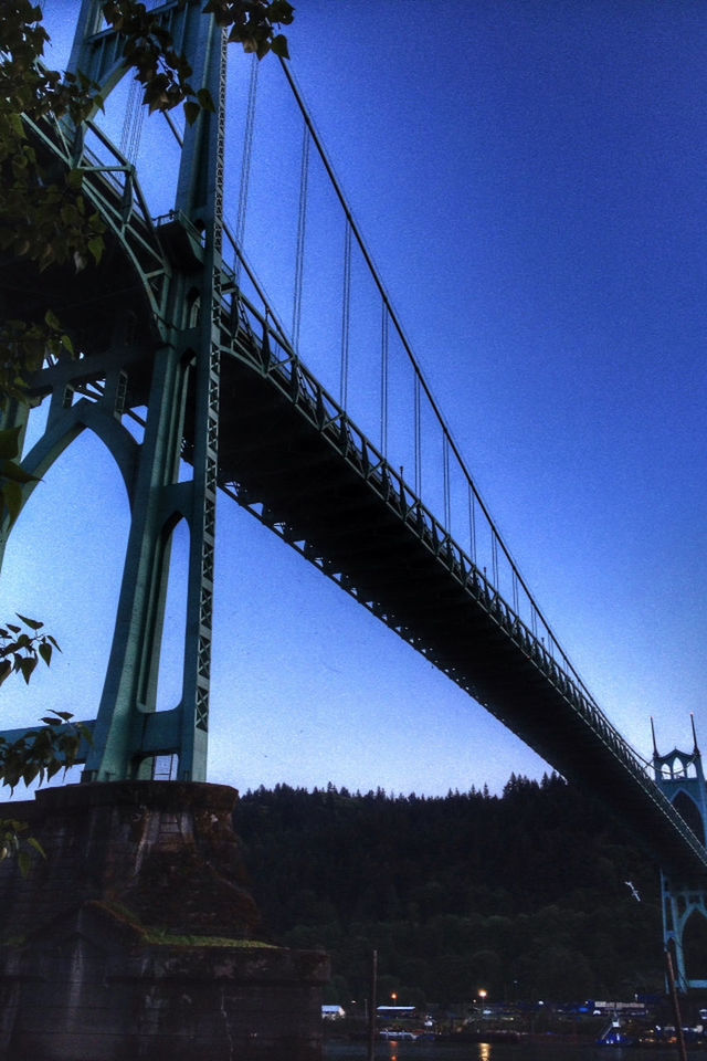 SUSPENSION BRIDGE AGAINST BLUE SKY