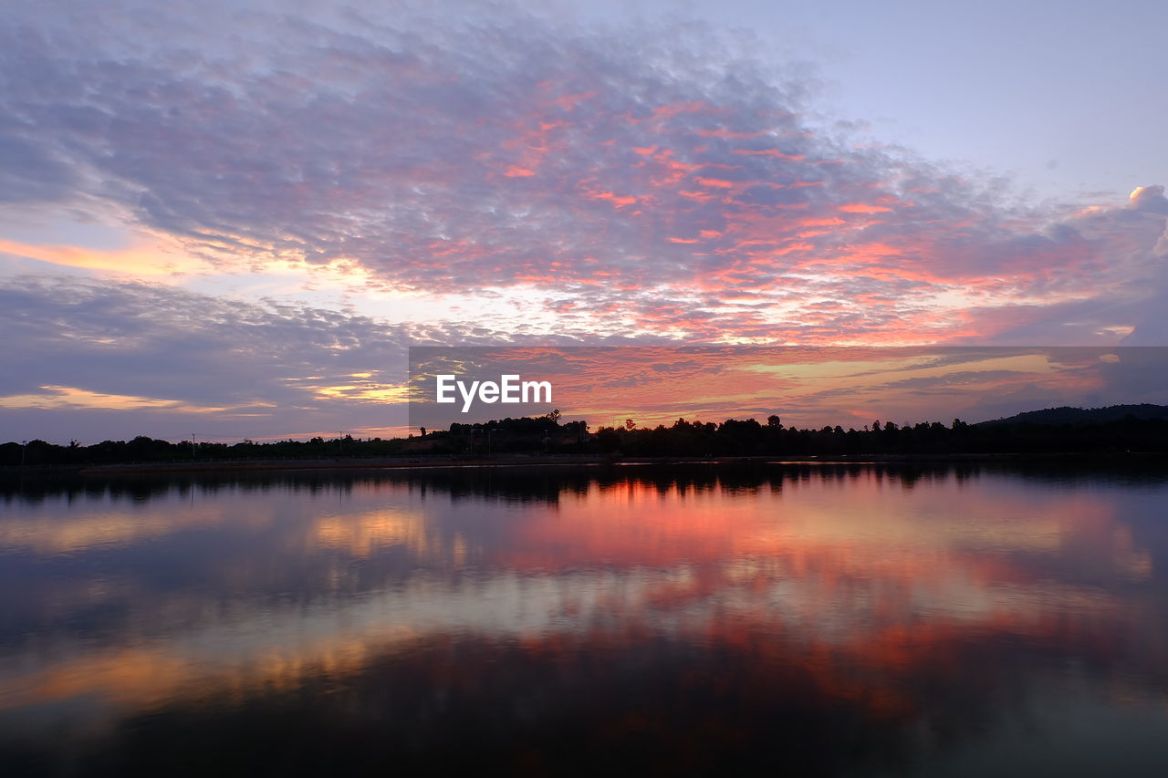 Reflection of clouds in calm lake