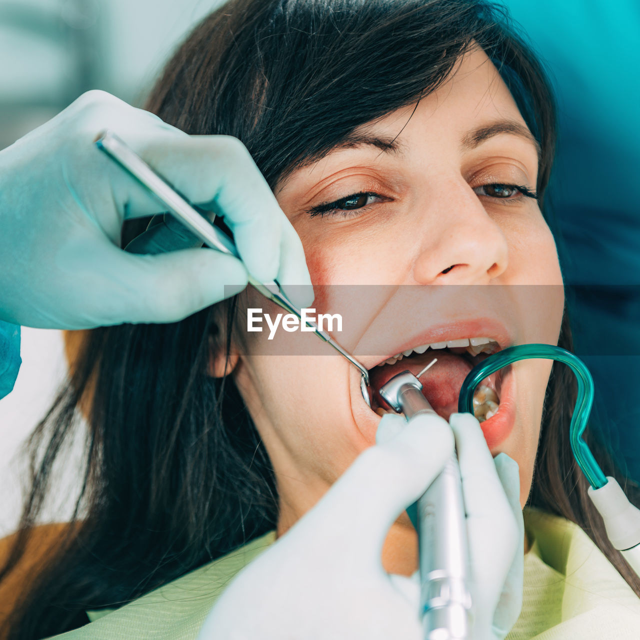 Cropped image of dentist examining patient