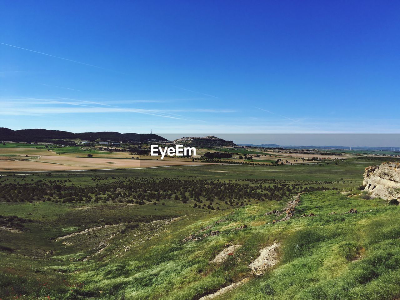 Scenic view of landscape against clear blue sky