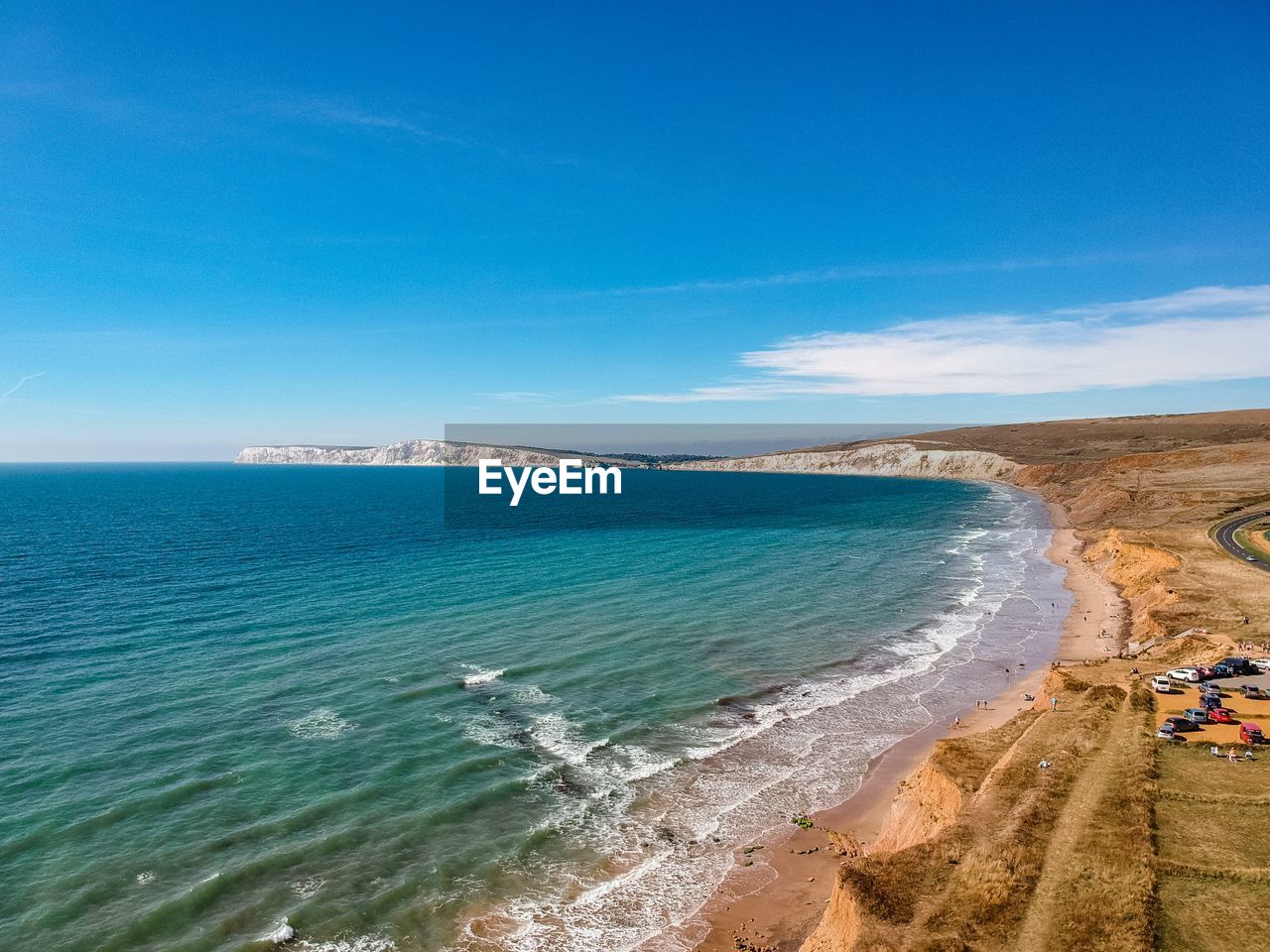 Scenic view of sea against blue sky