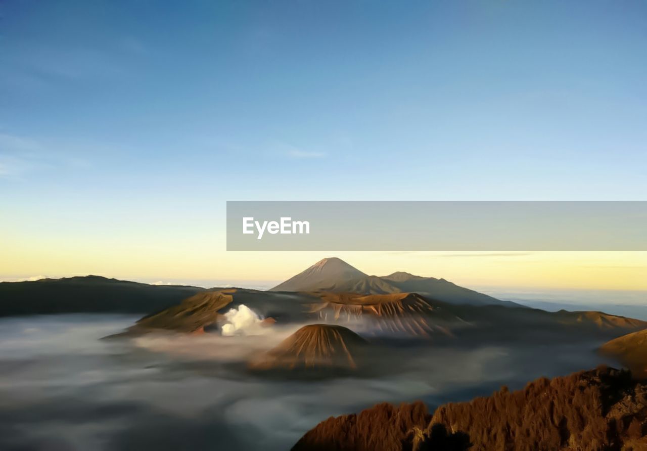 View of volcanic landscape against sky during sunset