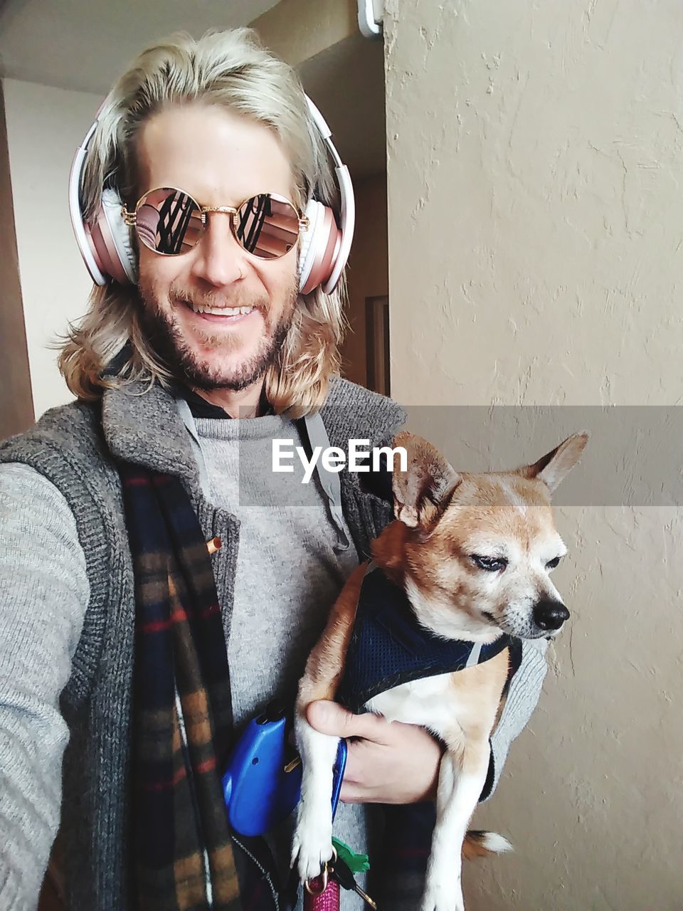 Portrait of smiling man with chihuahua dog