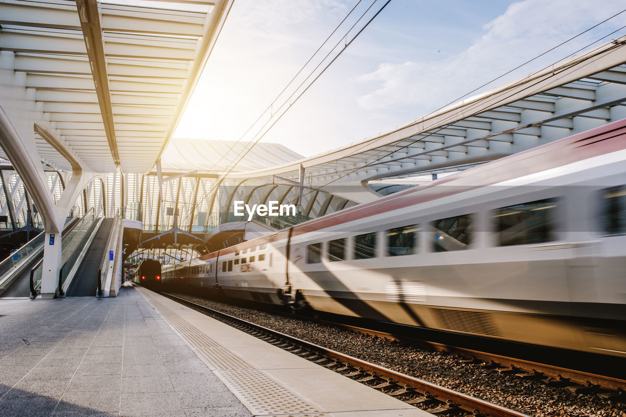 TRAIN AT RAILROAD STATION PLATFORM