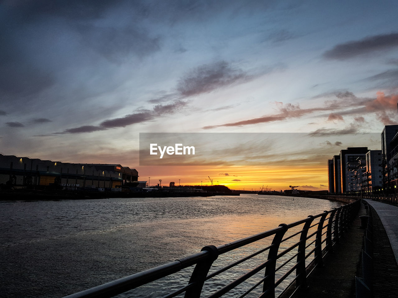 SCENIC VIEW OF SEA BY CITY AGAINST SKY