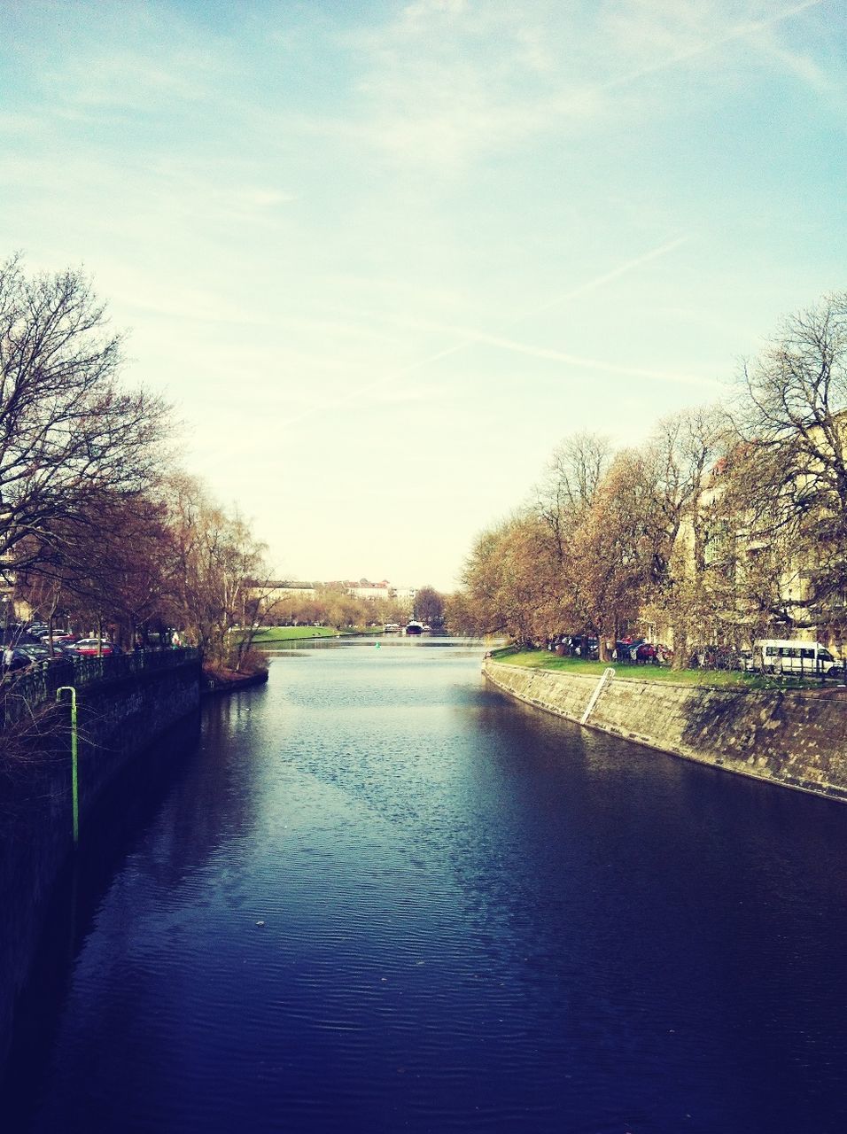 VIEW OF RIVER WITH TREES IN BACKGROUND