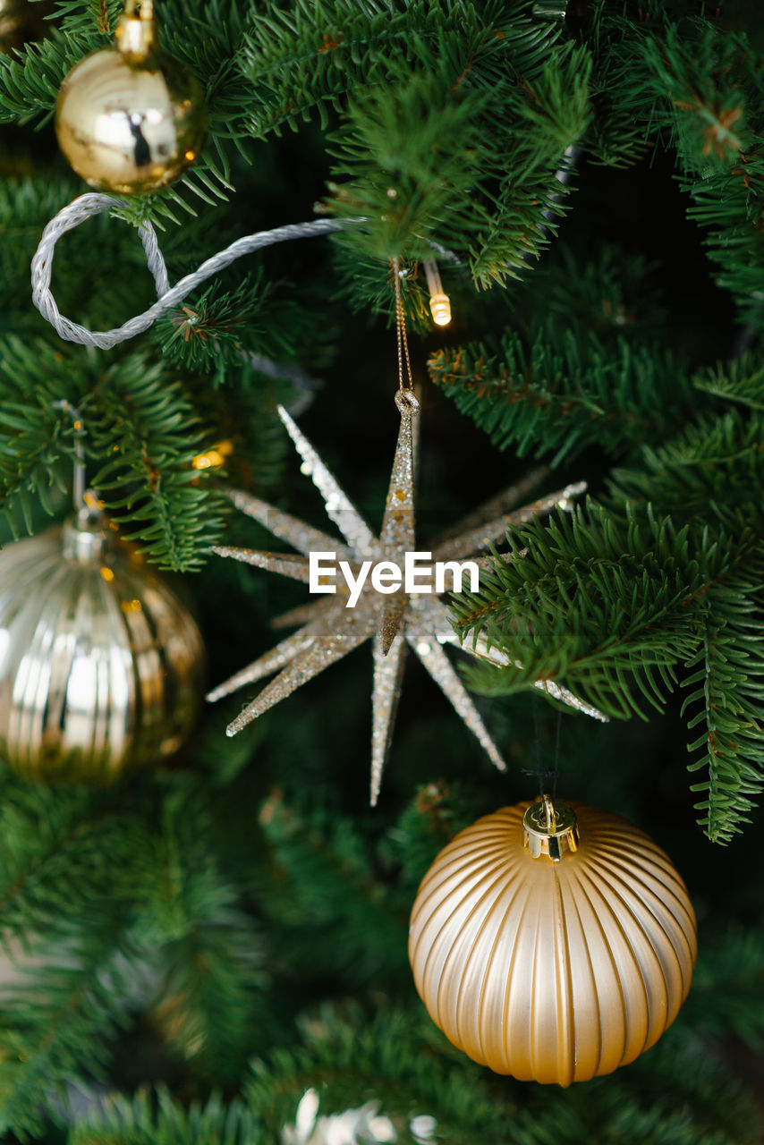 Background of christmas tree with golden toys lights