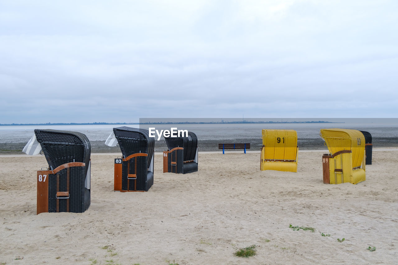 HOODED CHAIRS ON BEACH