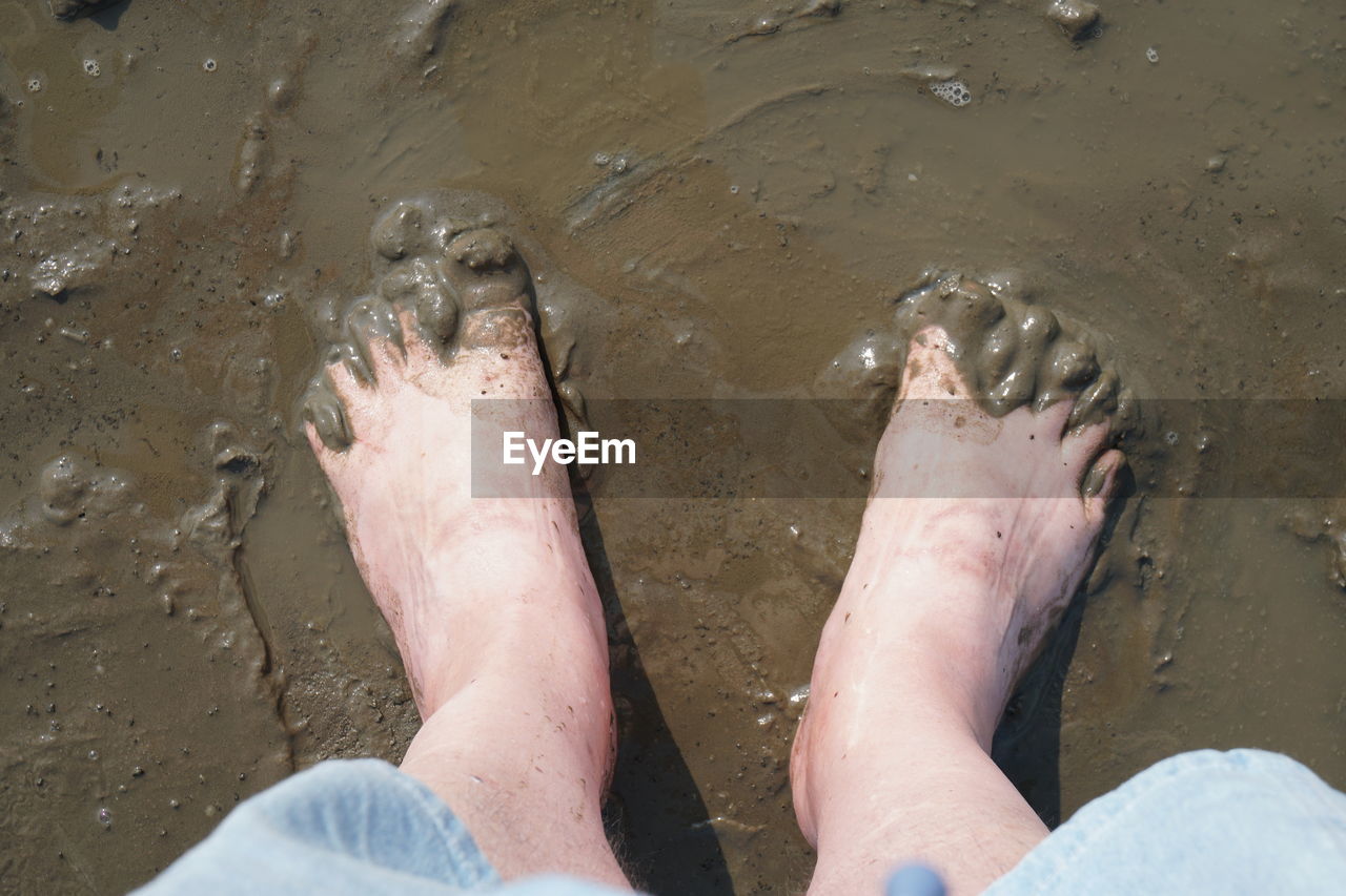 Barefoot on mudflat