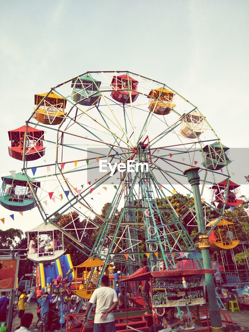 LOW ANGLE VIEW OF CAROUSEL AGAINST SKY