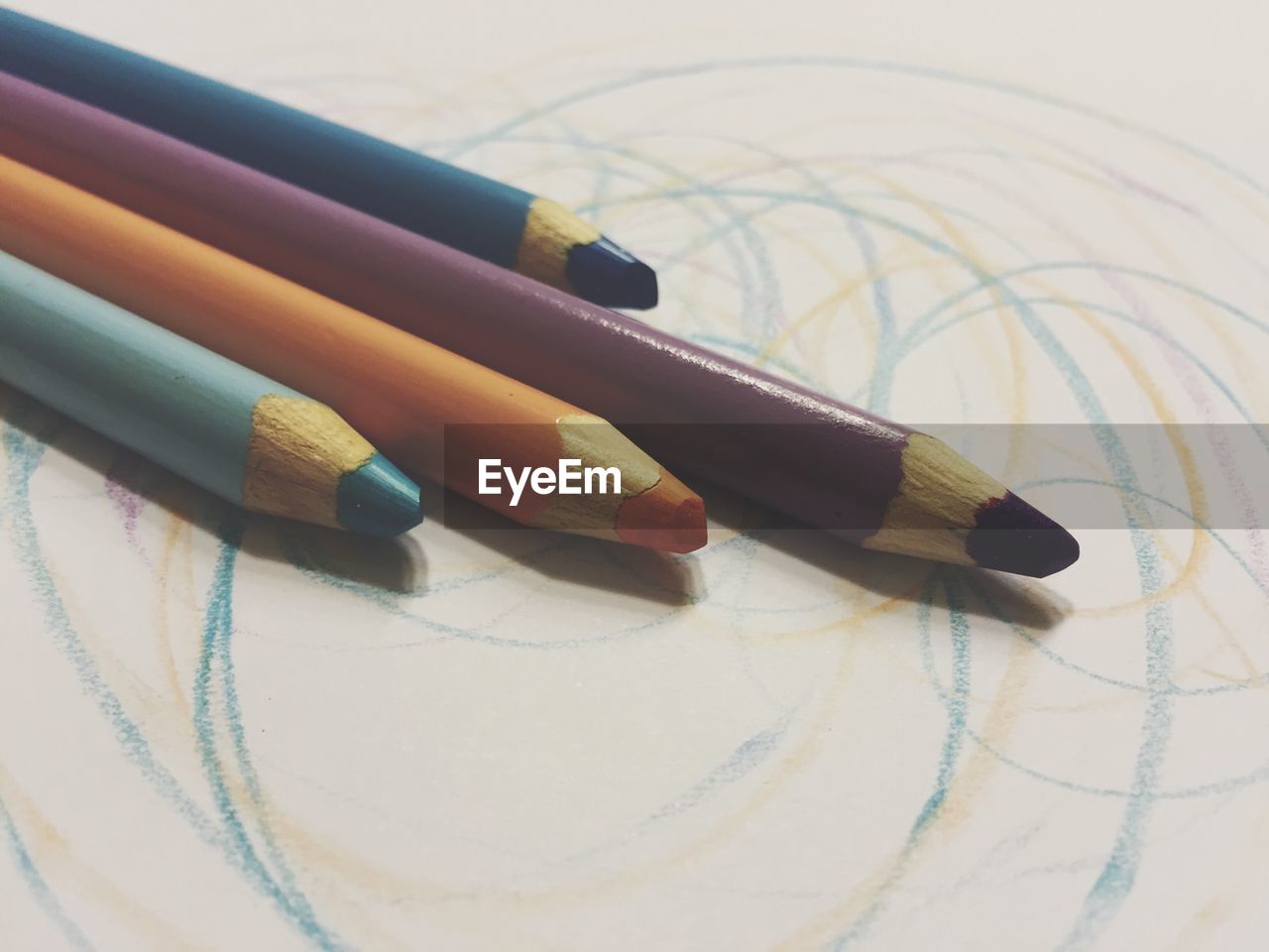Close-up of colored pencils on paper