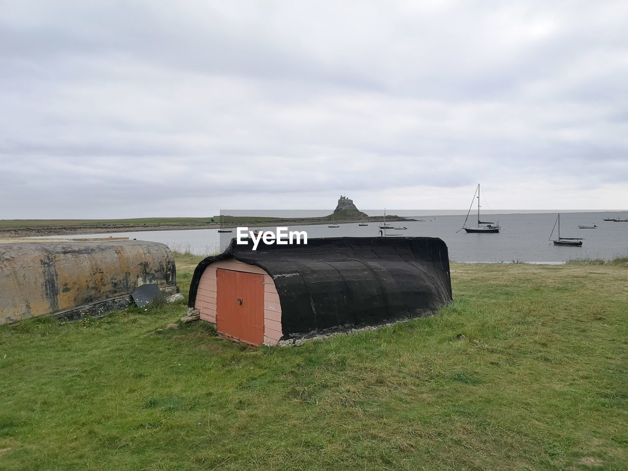 Fishermans hut constructed from an inverted boat. lindisfarne northumbria uk