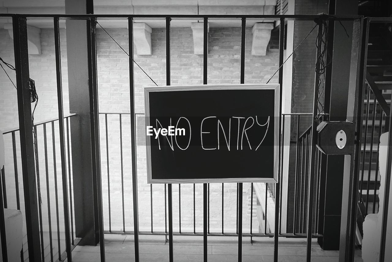 CLOSE-UP OF OPEN SIGN ON WINDOW OF BUILDING