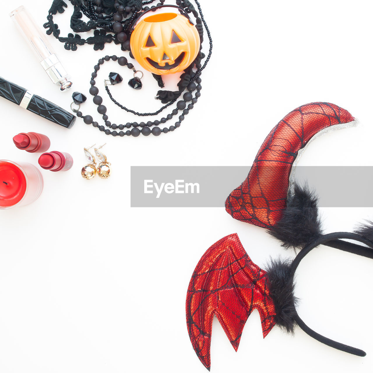 Directly above shot of halloween props on white background