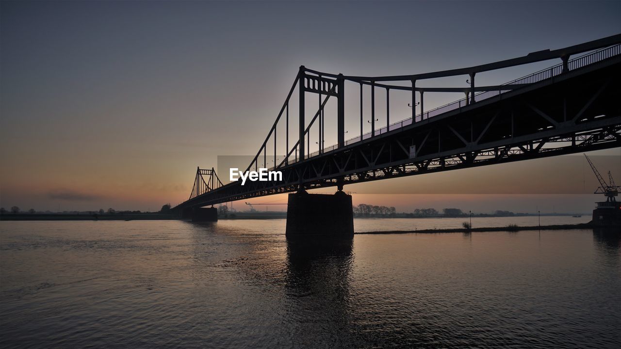 View of suspension bridge at sunset